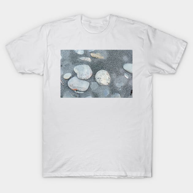 Stone scattered in sand on beach T-Shirt by brians101